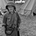 Young reenactor with realistic toy rifle